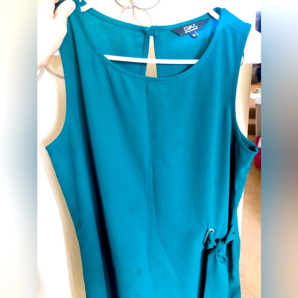 Cute teal top with knotted ribbon on the side like new